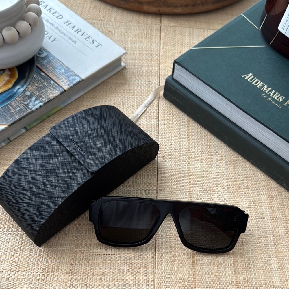 Prada Sleek Black Sunglasses with Textured Case